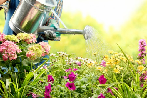 Gardener beginning a service with tools and checked booking details